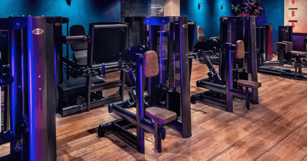 Real Stories: How Gym80 Transformed Gyms Across the Globe 1 Real gym equipment setup with weight stack machines in a modern fitness facility