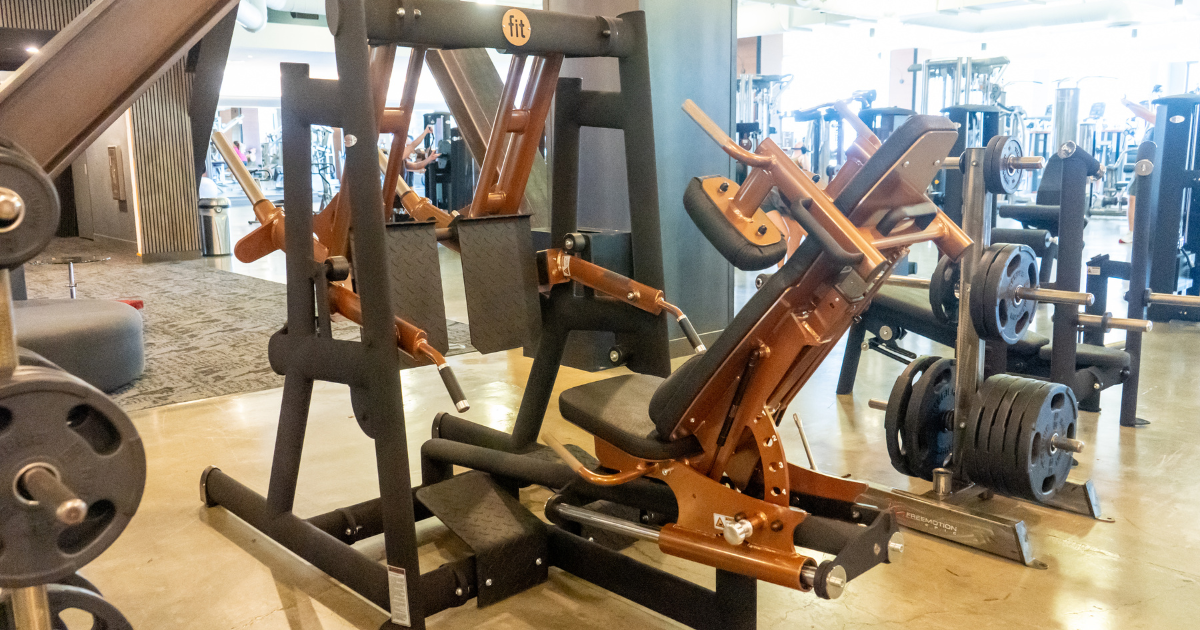 Leg press machine from Gym80’s Pure Kraft series, featuring German-engineered design, ergonomic biomechanics focus back support, and plate-loaded resistance for strength training