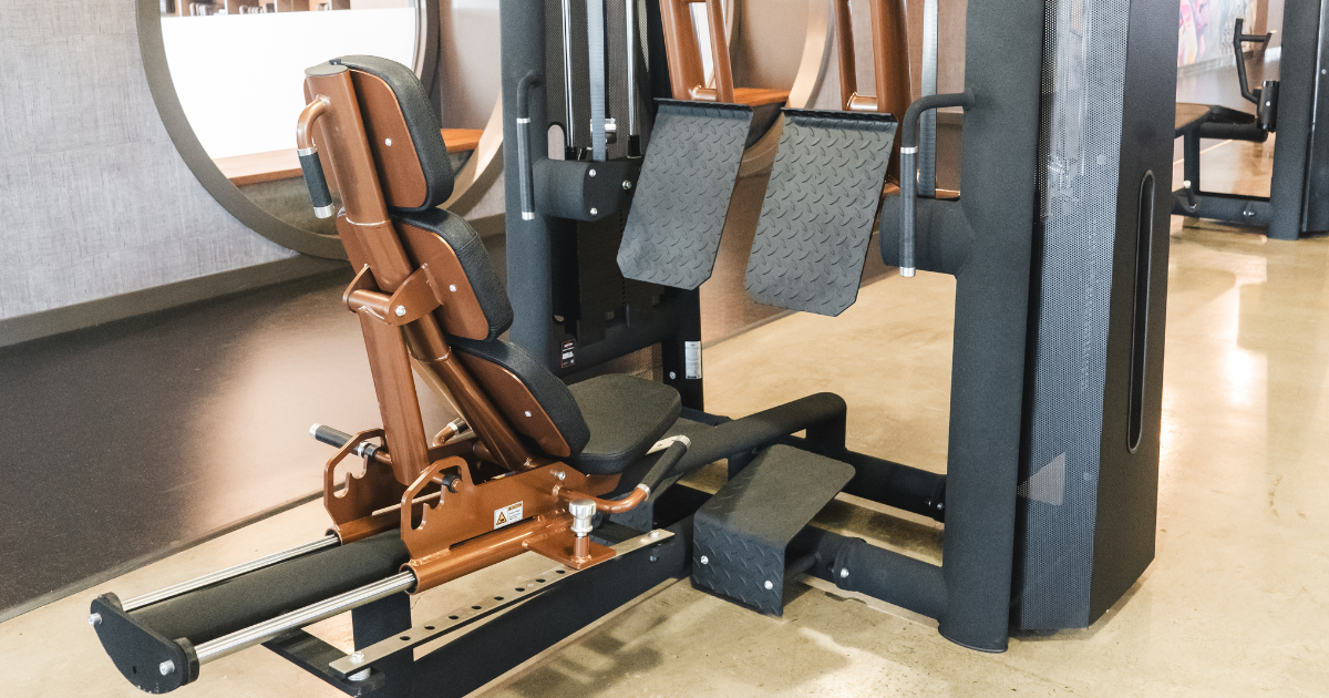 Leg press machine from Gym80’s Pure Kraft series, featuring German-engineered design, ergonomic back support, and plate-loaded resistance for strength training