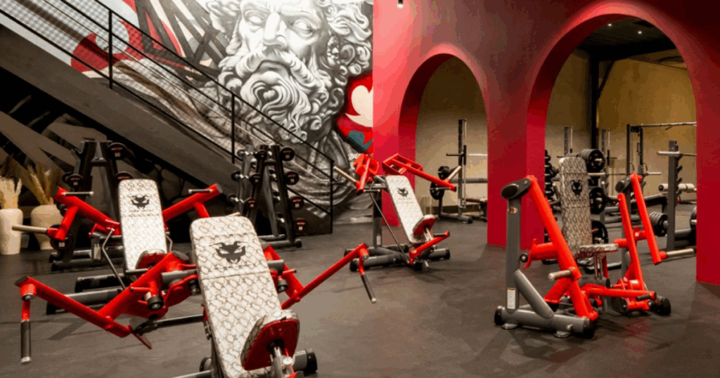 Custom Gym80 strength machines with ergonomic curves designed for biomechanics and athlete performance.