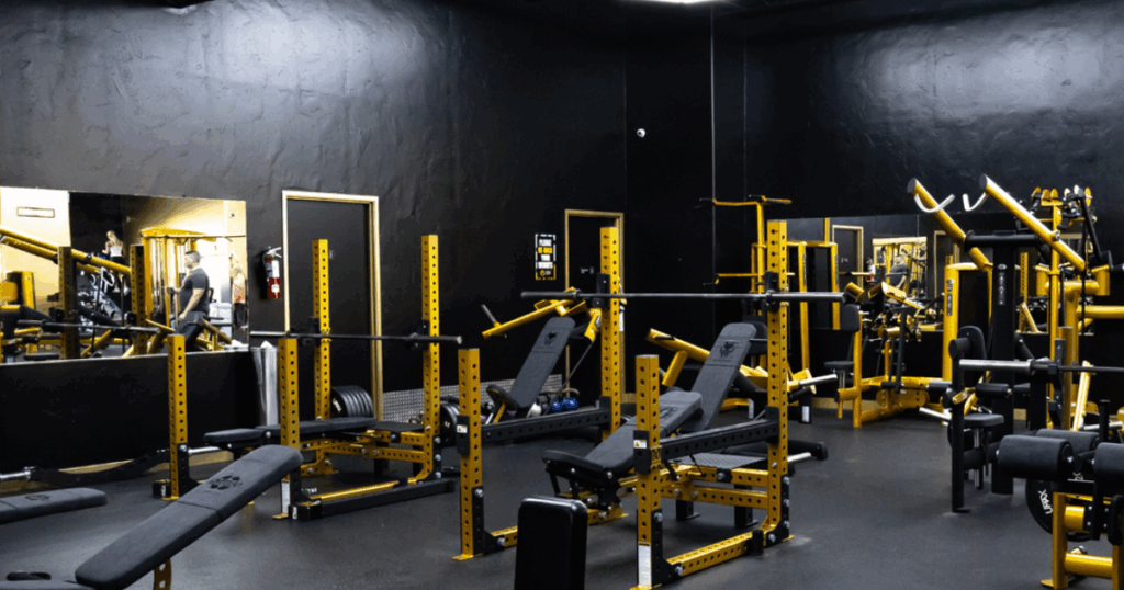 Why One Size Doesn’t Fit All in Fitness Equipment Design 1 Modern weightlifting facility with Gym80 machines, squat racks, and advanced equipment designed to help athletes and fitness enthusiasts stay fit.