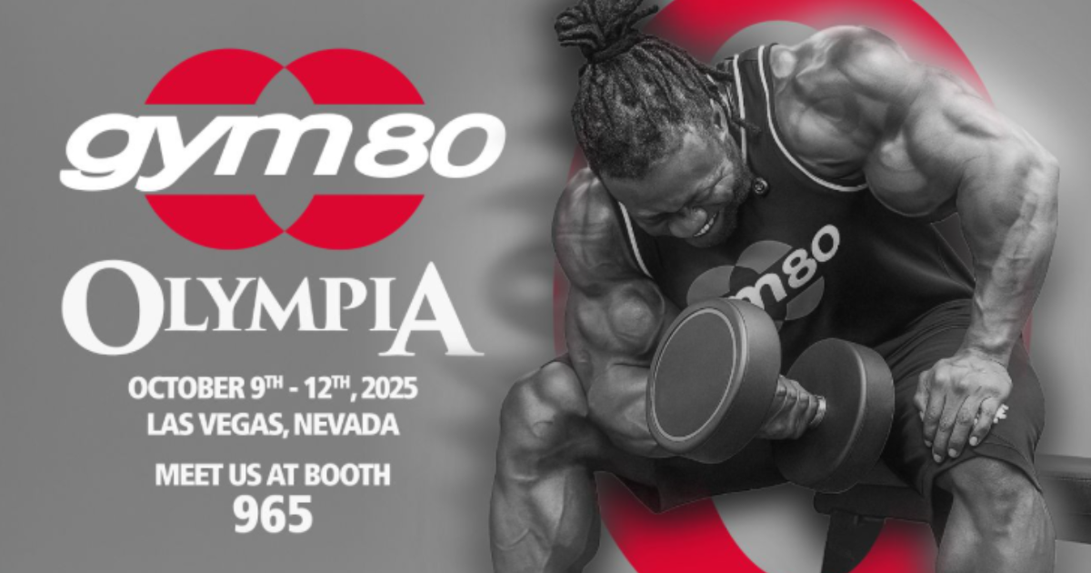 Professional bodybuilder showcasing Gym80 strength equipment at Mr. Olympia 2025 in Las Vegas, Booth 965