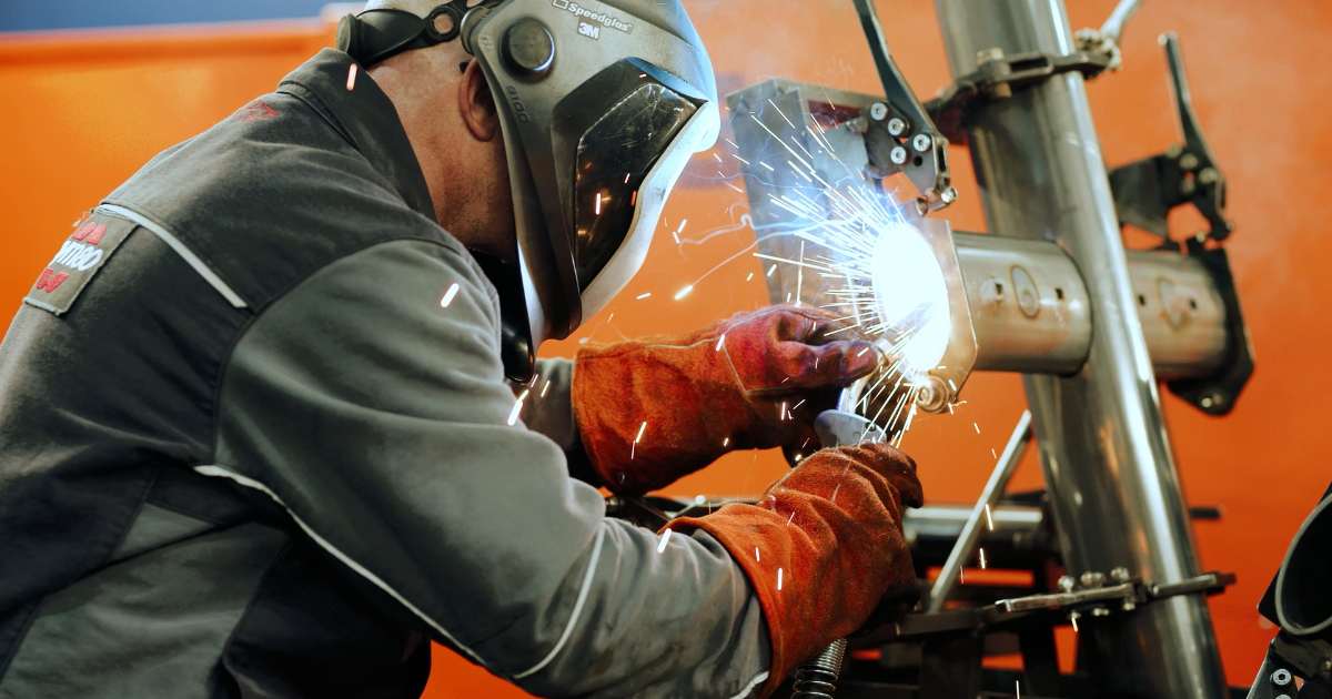 Welding process at Gym 80 factory ensuring welded construction for durable, joint-safe, and biomechanics strength training equipment