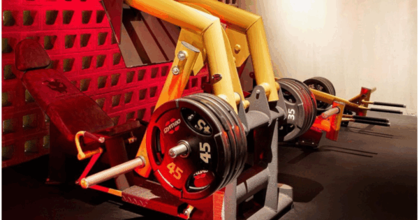 Gym80 Pure Kraft plate-loaded leg press and strength machines showcasing welded-frame construction, precision resistance curves, and biomechanically aligned movement paths for advanced lifters.