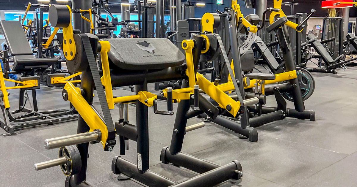 Gym80 Pure Kraft plate-loaded strength machines featuring precision resistance curves, welded-frame stability, and biomechanically aligned movement paths designed for successful reps and experienced lifters.
