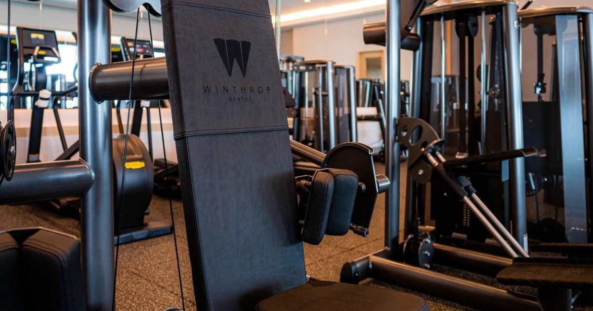 Selectorized strength machines in a commercial training facility featuring smooth weight-stack resistance, ergonomic adjustments, and welded-frame construction ideal for controlled, joint-friendly Gym80-style movement.